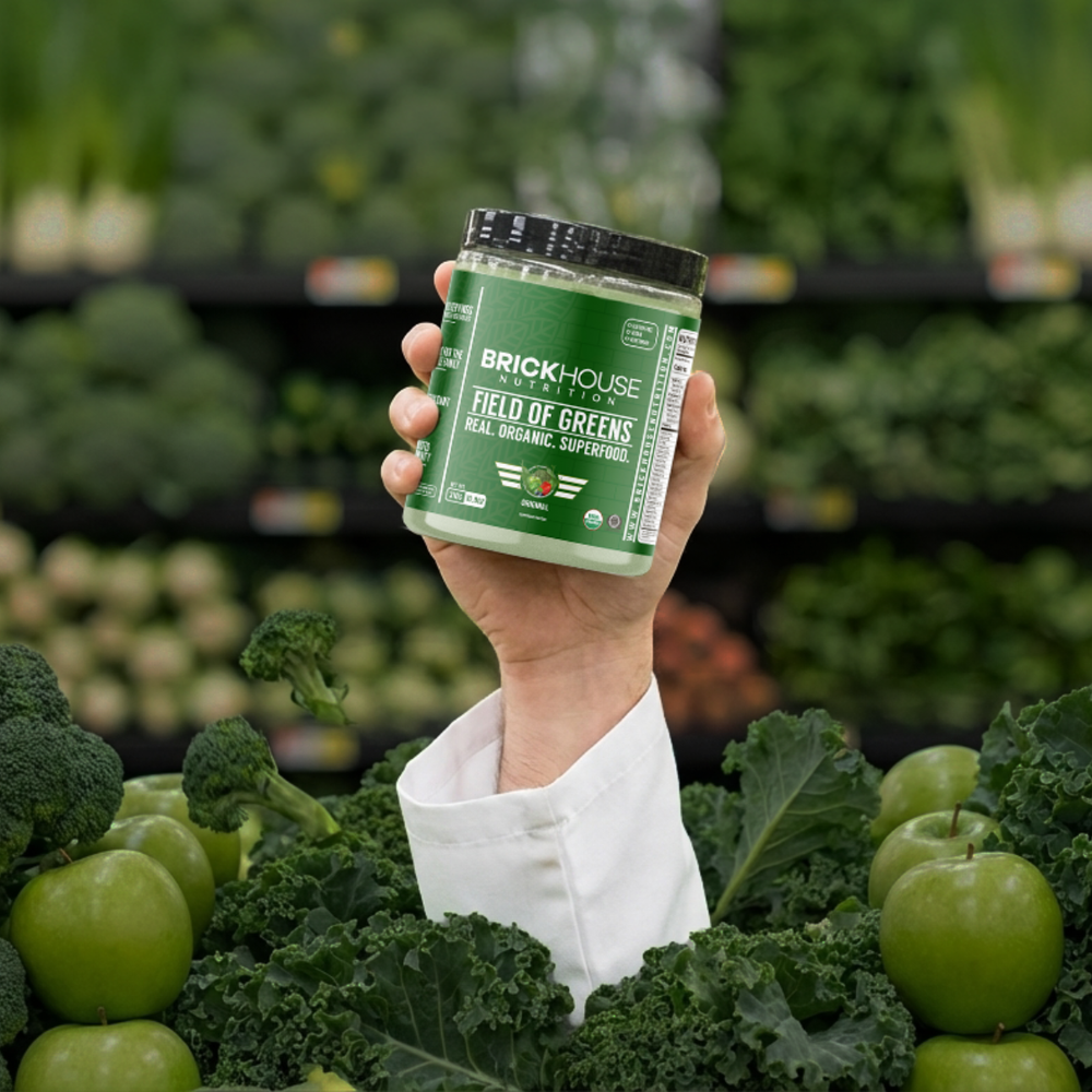 Field of Greens supplement held in a garden