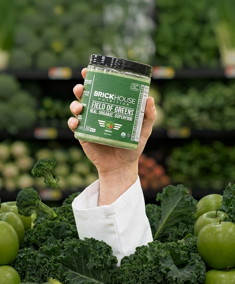 Field of Greens supplement held in a garden